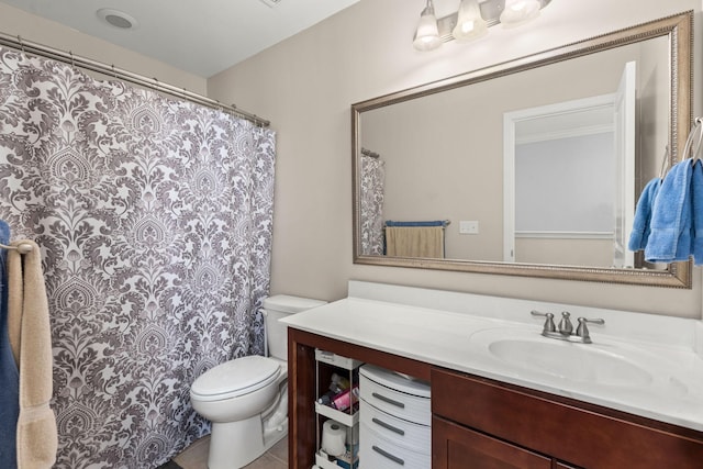 full bathroom featuring tile patterned flooring, toilet, and vanity