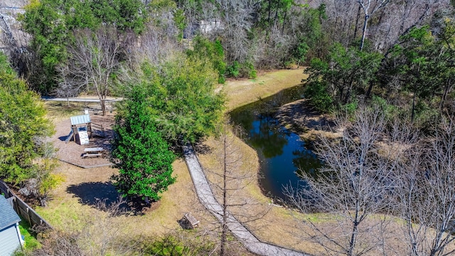 aerial view featuring a water view and a wooded view