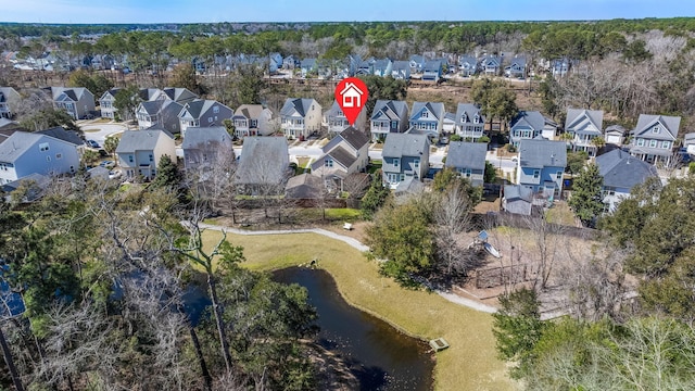 bird's eye view with a residential view and a water view