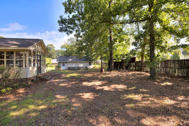 view of yard with a sunroom