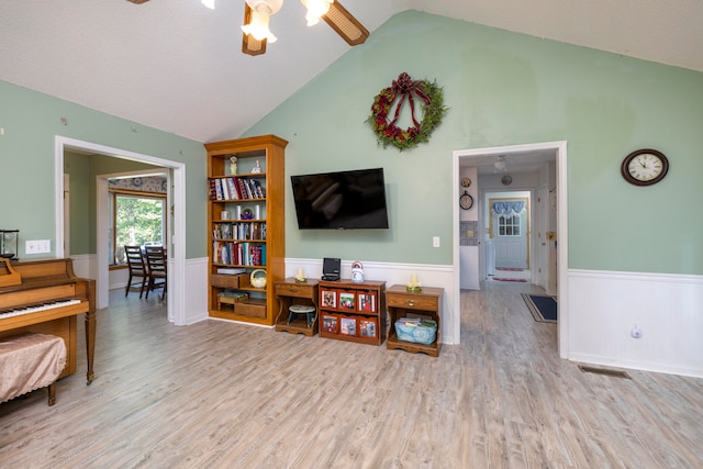 interior space featuring lofted ceiling, ceiling fan, and light hardwood / wood-style floors