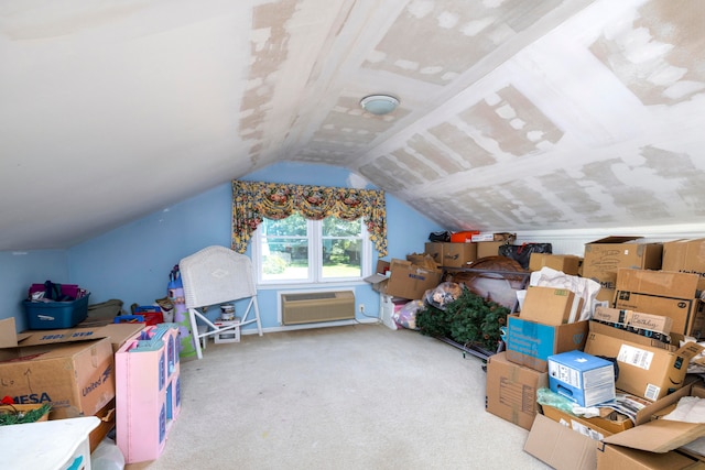 interior space with carpet, vaulted ceiling, and a wall mounted air conditioner