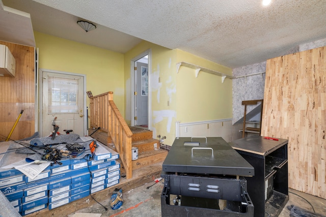 interior space featuring concrete floors and a textured ceiling