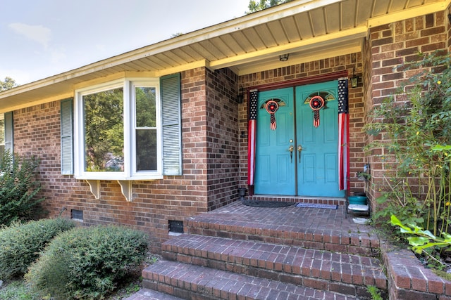 view of exterior entry featuring a porch