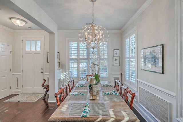 dining space featuring crown molding, visible vents, dark wood-type flooring, and a notable chandelier