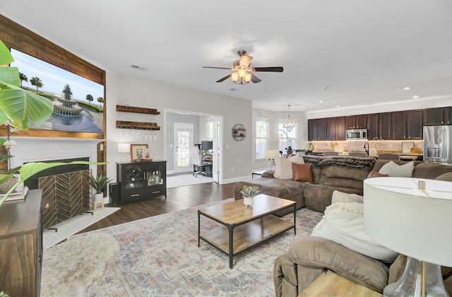 living room with hardwood / wood-style floors and ceiling fan