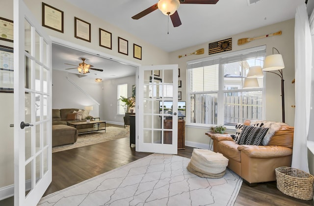 sitting room with french doors, ceiling fan, and dark hardwood / wood-style floors