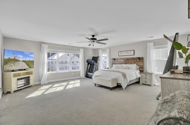 bedroom with light carpet and ceiling fan