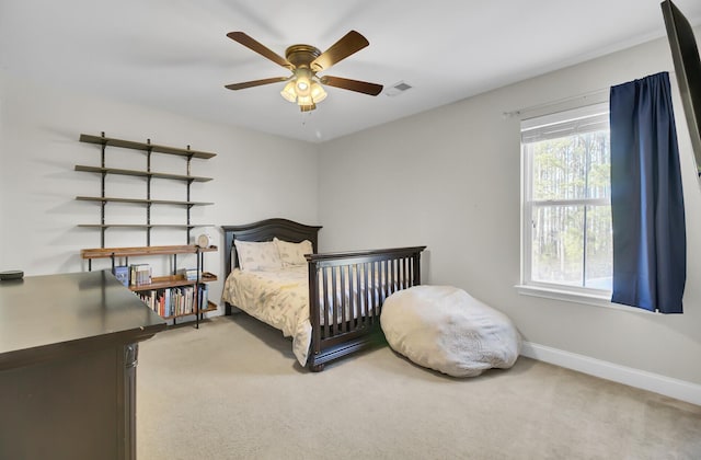 carpeted bedroom with ceiling fan