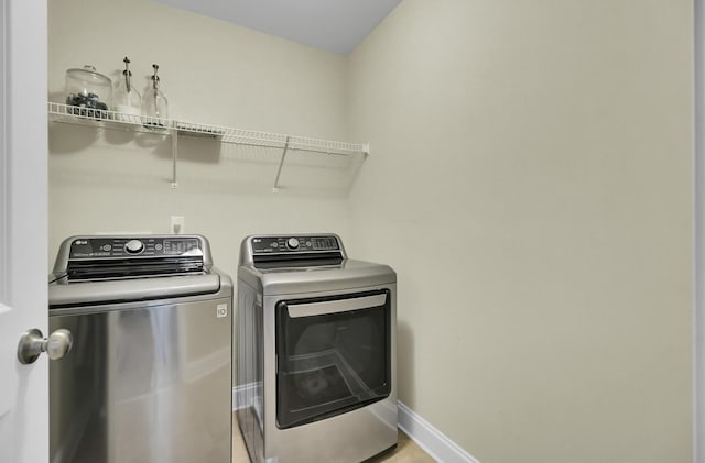 washroom featuring independent washer and dryer