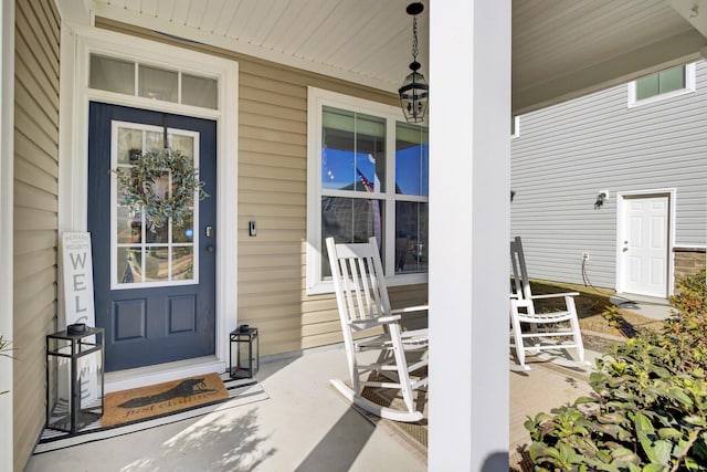 property entrance featuring covered porch