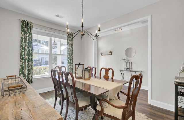 dining area with dark hardwood / wood-style flooring