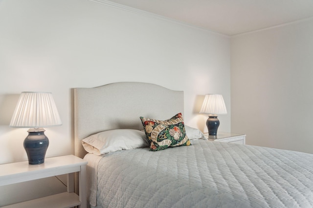 bedroom featuring crown molding