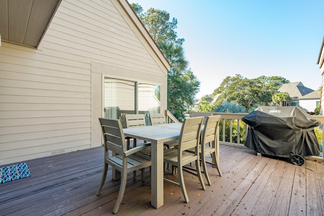 wooden deck featuring area for grilling