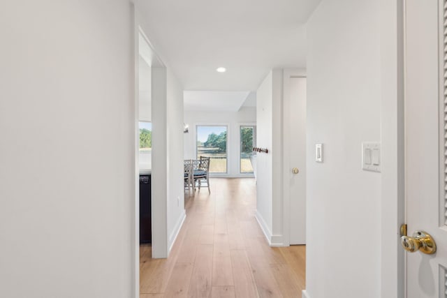 hall with light hardwood / wood-style floors