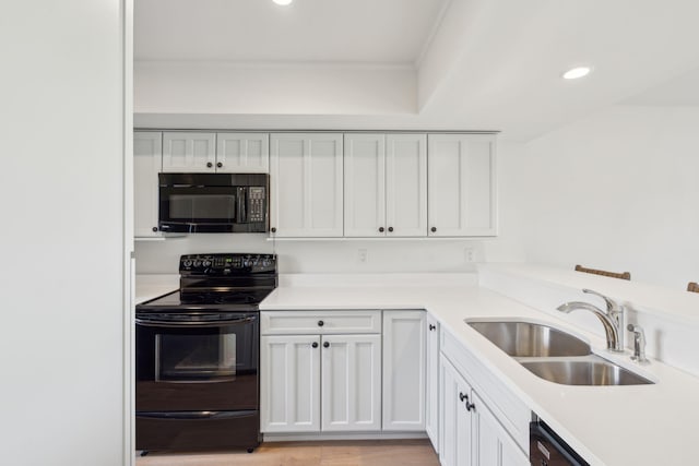 1505 Marsh Hvn, Johns Island, SC 29455 - kitchen with black appliances, a sink, ornamental molding, recessed lighting, and white cabinetry