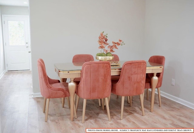 dining area with light wood-type flooring