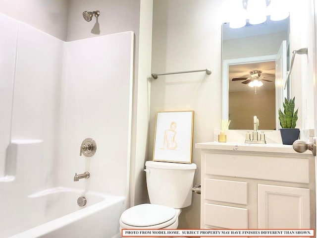 full bathroom featuring ceiling fan, vanity, toilet, and tub / shower combination