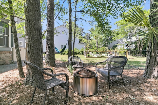 view of yard featuring an outdoor fire pit