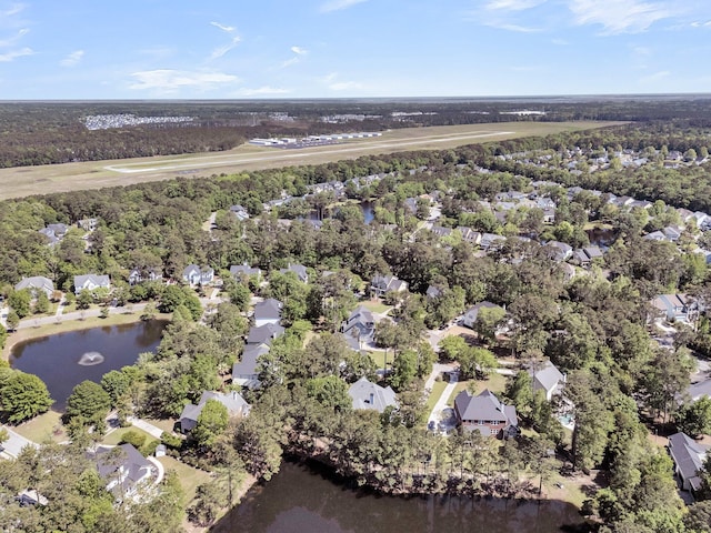 view of property location with a large body of water and nearby suburban area