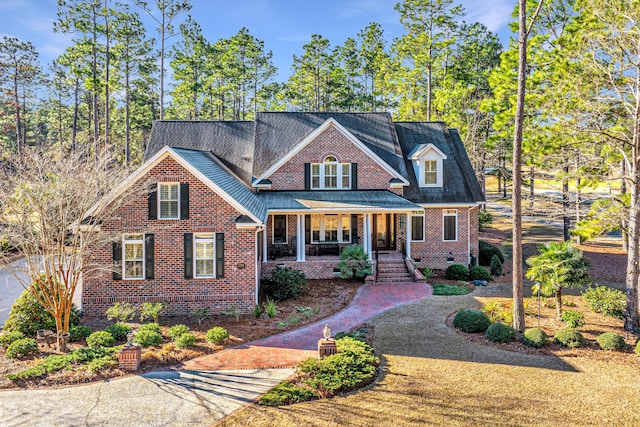 view of property featuring covered porch