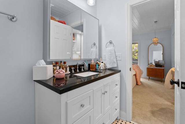 bathroom featuring crown molding, visible vents, vanity, and wood ceiling