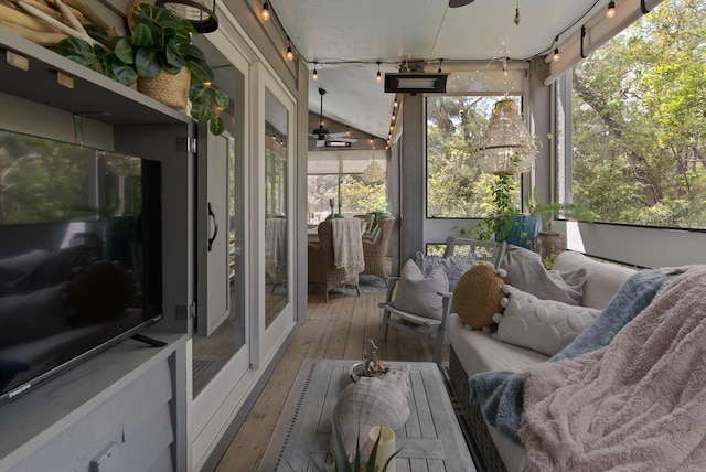 sunroom with a ceiling fan