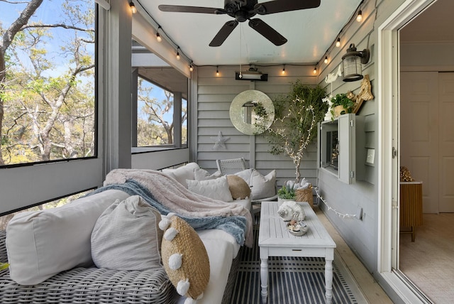 interior space featuring an outdoor living space, a ceiling fan, and rail lighting
