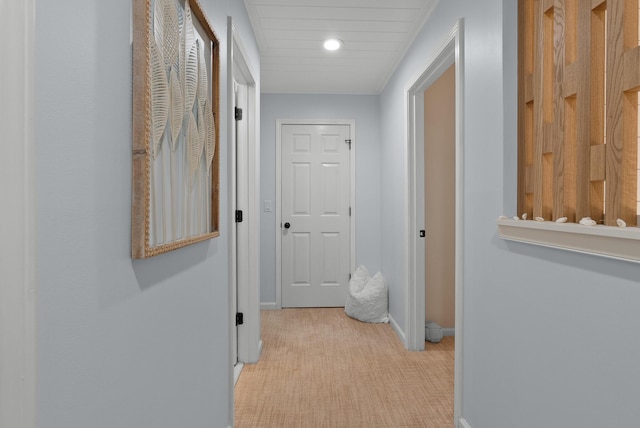 corridor featuring light colored carpet, baseboards, and recessed lighting