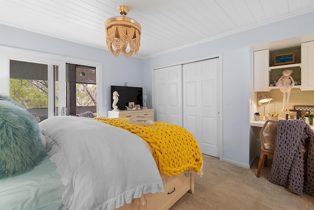bedroom featuring a closet, light colored carpet, wooden ceiling, and an inviting chandelier