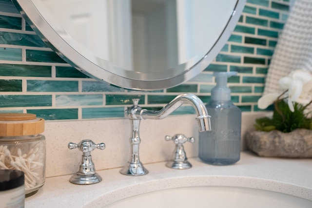 interior details with a sink and backsplash