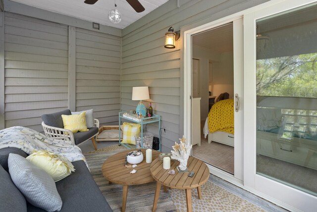 exterior space featuring ceiling fan