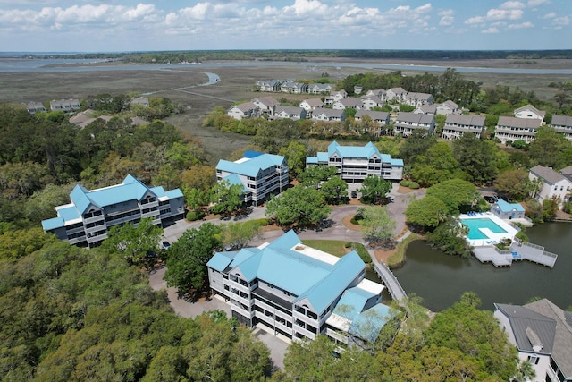 drone / aerial view featuring a water view and a residential view