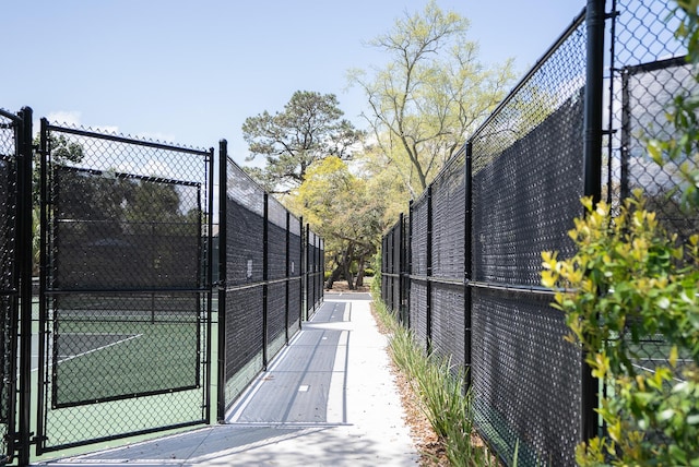 exterior space featuring fence and a gate