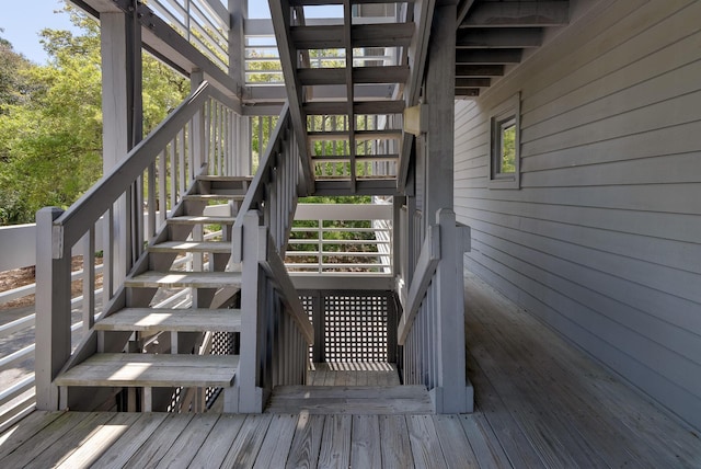 wooden deck featuring stairs