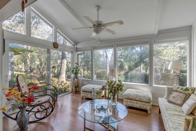 sunroom / solarium featuring ceiling fan and vaulted ceiling