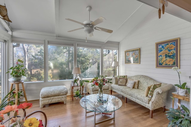 sunroom / solarium featuring vaulted ceiling with beams and ceiling fan