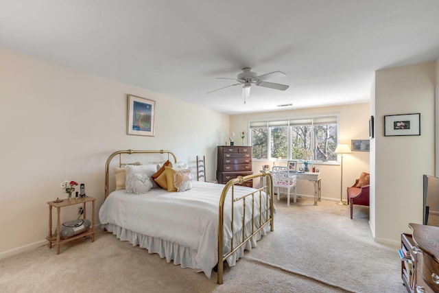 bedroom featuring light carpet and ceiling fan