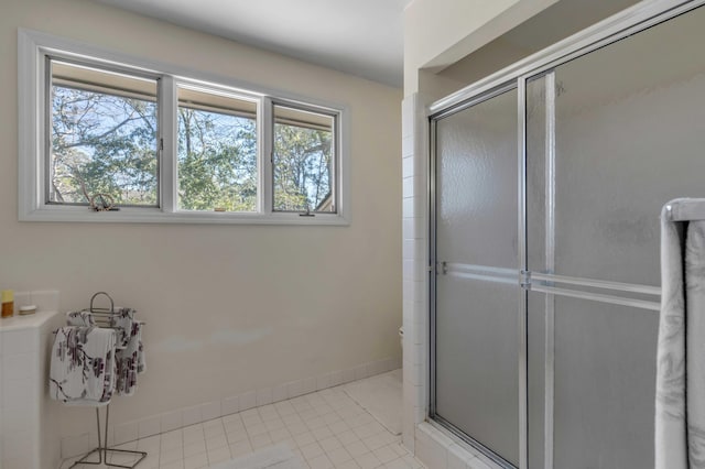 bathroom featuring tile patterned floors and walk in shower