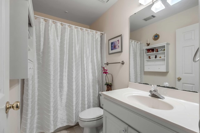 bathroom with tile patterned floors, ceiling fan, vanity, and toilet