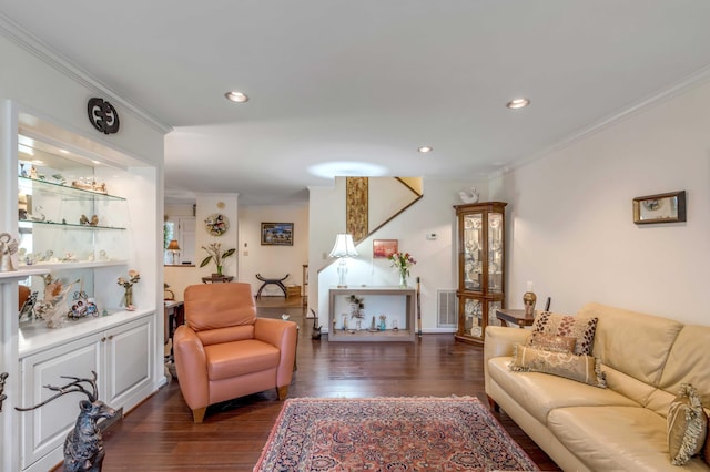 living room featuring dark wood-type flooring and ornamental molding