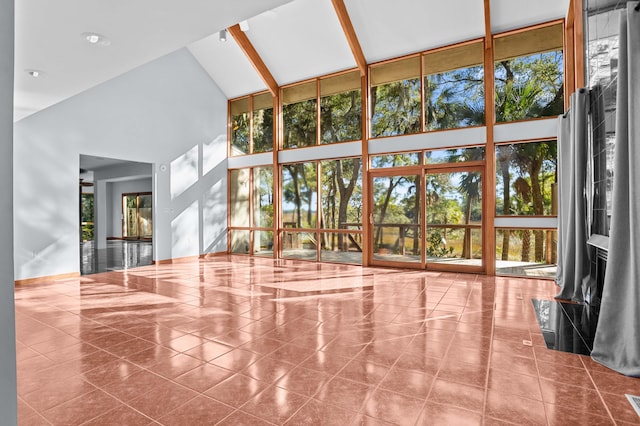 unfurnished sunroom with lofted ceiling