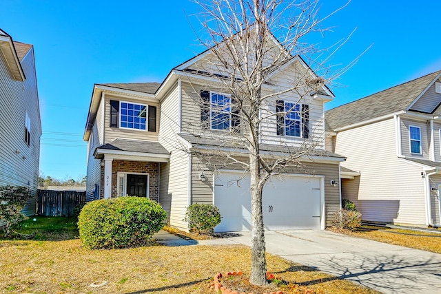 view of front facade featuring a garage and a front yard