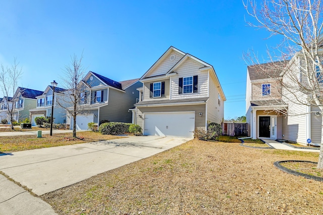 view of front of house featuring a garage and a front yard