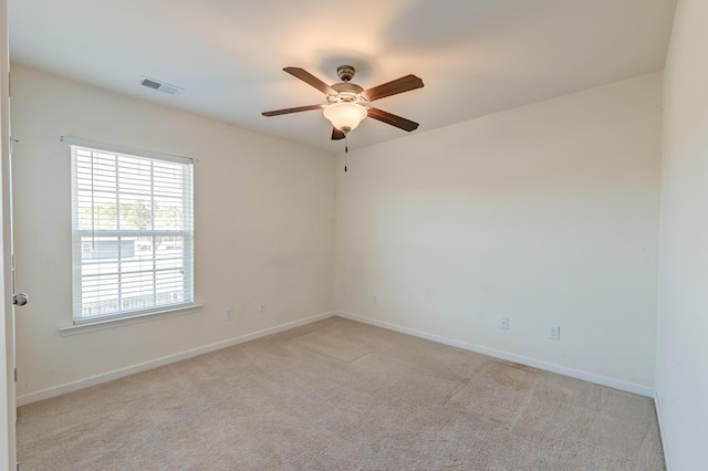 empty room with light carpet and ceiling fan