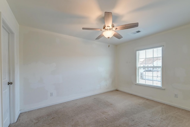 carpeted empty room with ceiling fan