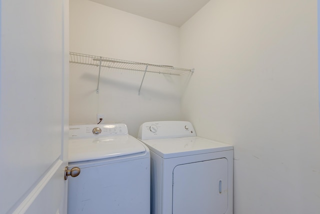 laundry room featuring washing machine and dryer