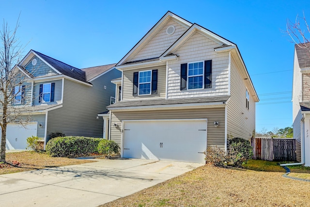 view of front of home featuring a garage and a front lawn