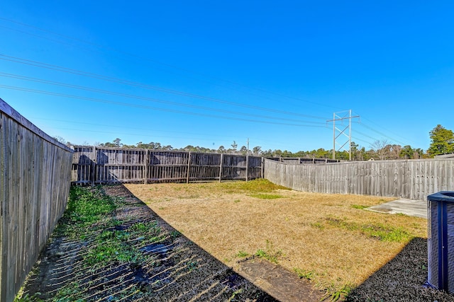 view of yard with central AC