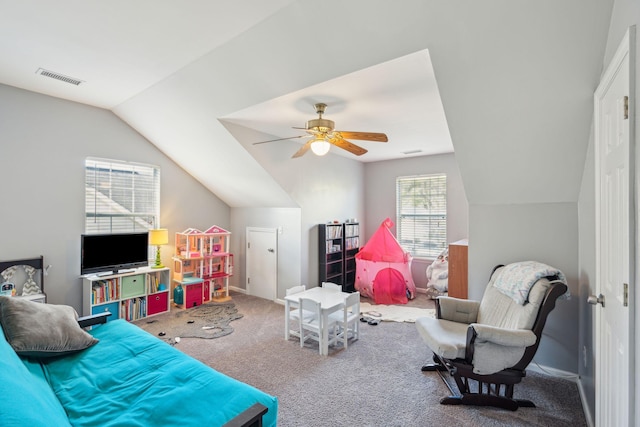 recreation room featuring ceiling fan, lofted ceiling, and carpet floors